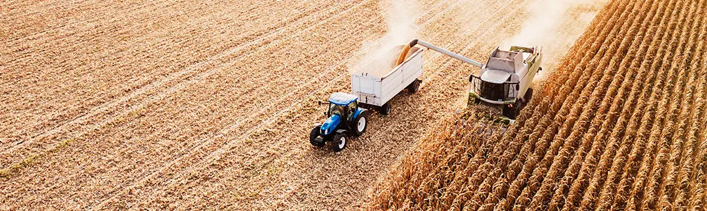 Tractor in Field Using Agriculture Lubricants