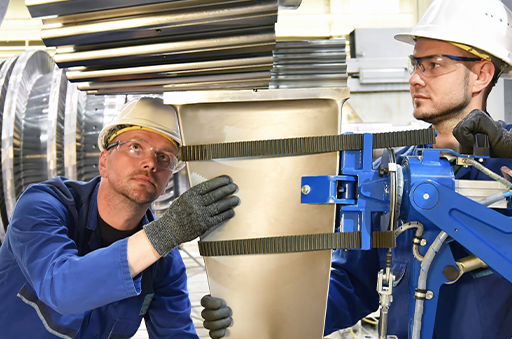 Industrial Workers Using Equipment Protected with Industrial Lubricants & Industrial Oils