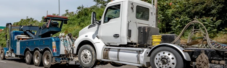 Truck Being Towed After Breakdown From Cheap Bulk Engine Oil